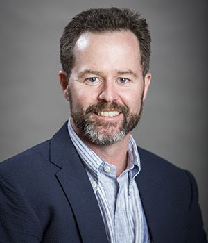Headshot of Todd Brennan.
